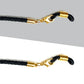 Black sunglass strap detail with gold hardware
