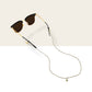 Cream sunglass strap: off-white woven vegan leather cord on sunglasses