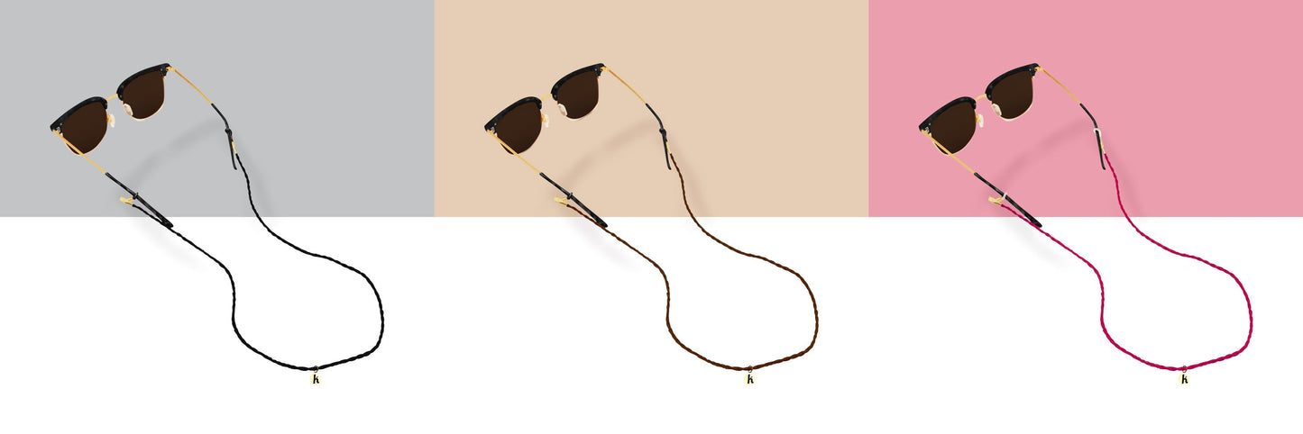 All three Keebos sunglass strap colors side by side: black, brown and pink, each on sunglasses with a gold Keebos pendant